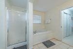 Spacious bath with walk in shower and separate tub